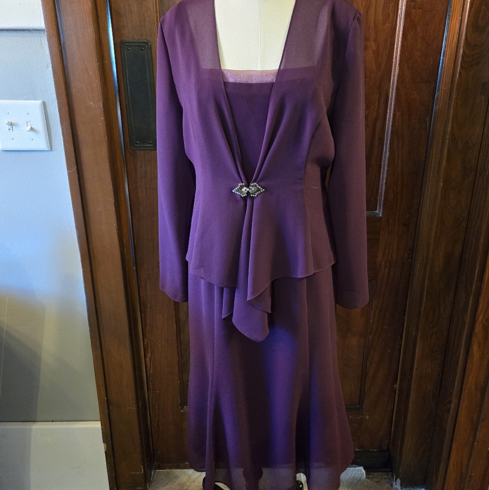 Beautiful plum colored,formal dress with a sheer jacket by Ursula, size 12.